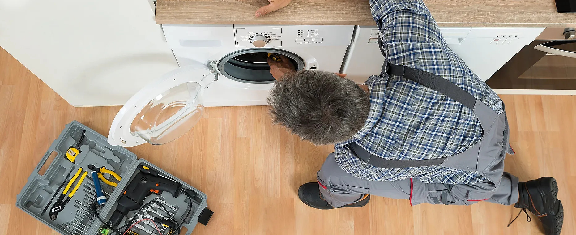 A man cleaning a dryer vent